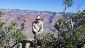 Intrepid hiker on the precipice. 