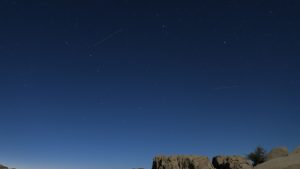 The a Big Dipper with a meteor across the sky. 