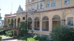 This shows the walkway to the pool and fountain at Baker Hotel.